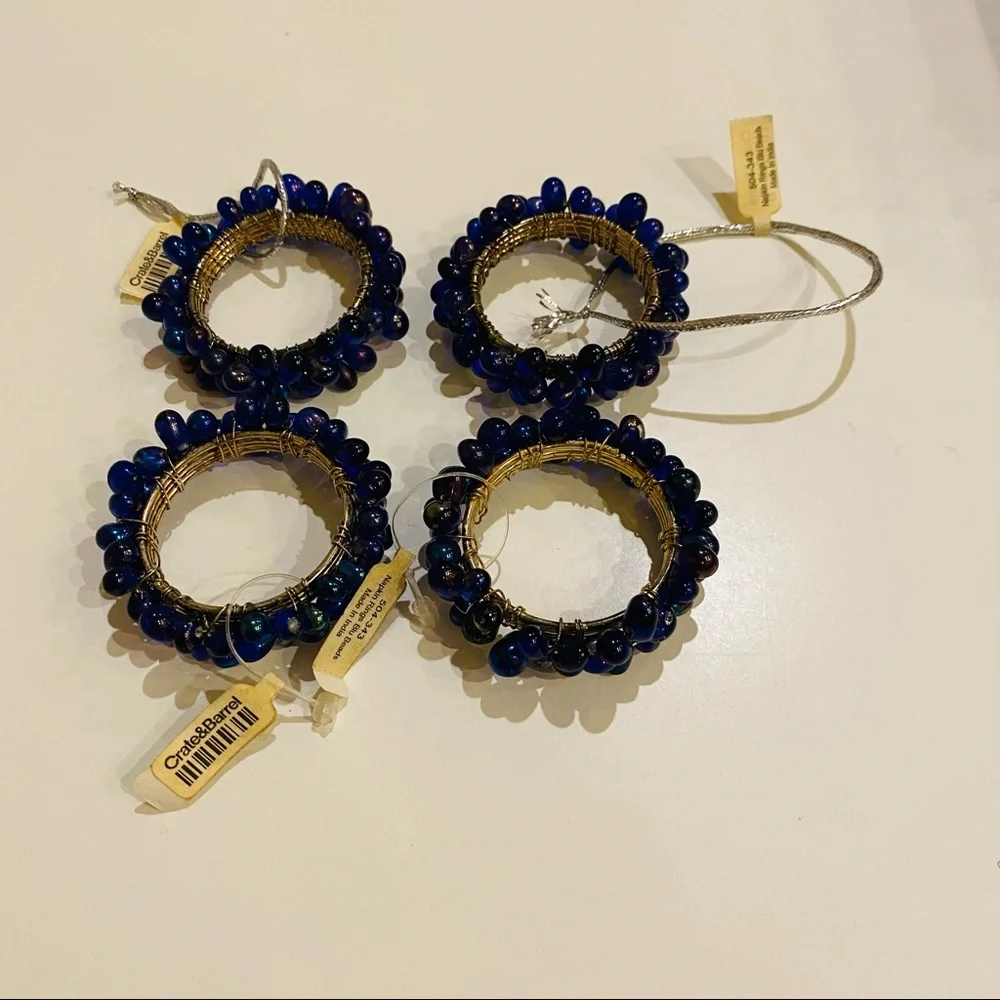NWT Crate & Barrel 4 Napkin Rings.Blu Iridescent Beads.Great for casual or party